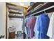 Well-organized closet with shelving, hanging rods, and ample storage space at 238 Tampa W Ave # 217, Venice, FL 34285