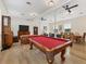 Community game room with billiard table, seating area, and dining tables at 238 Tampa W Ave # 217, Venice, FL 34285