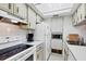 This compact kitchen has essential appliances, bright lighting, and ample cabinet space at 238 Tampa W Ave # 217, Venice, FL 34285