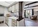 Kitchen featuring white countertops and cabinetry, and an open design into the living room at 238 Tampa W Ave # 217, Venice, FL 34285