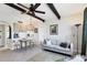 Open-concept living room featuring a sofa and a view of the kitchen and dining area at 238 Tampa W Ave # 217, Venice, FL 34285