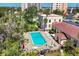 Aerial shot of a community pool surrounded by lounge chairs and manicured landscaping at 238 Tampa W Ave # 217, Venice, FL 34285