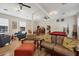 Spacious recreation room featuring a pool table, comfortable seating, and ample natural light at 238 Tampa W Ave # 217, Venice, FL 34285