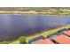Enjoy waterfront living with this home's screened-in pool overlooking a serene lake at 23823 Waverly Cir, Venice, FL 34293