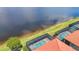 This home features a screened-in pool and spa with a beautiful lake view at 23823 Waverly Cir, Venice, FL 34293