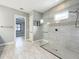 Modern bathroom with a glass-enclosed shower and sleek, contemporary fixtures at 23823 Waverly Cir, Venice, FL 34293