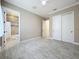 Bedroom with tile flooring, closet, and a view into an ensuite bathroom at 23823 Waverly Cir, Venice, FL 34293