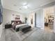 Well-lit bedroom featuring tile flooring, a ceiling fan, and neutral wall paint color at 23823 Waverly Cir, Venice, FL 34293