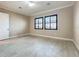 Bedroom with tile flooring and a ceiling fan featuring black window frames at 23823 Waverly Cir, Venice, FL 34293