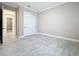 Bedroom featuring tile floors, base trim, and closet at 23823 Waverly Cir, Venice, FL 34293