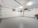 Spacious garage with epoxy flooring and shelving units at 23823 Waverly Cir, Venice, FL 34293
