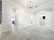 Bright living room with neutral paint, archways, and tile floors at 23823 Waverly Cir, Venice, FL 34293