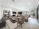 Inviting living room showcases an open floor plan with views of the kitchen and dining area at 23823 Waverly Cir, Venice, FL 34293