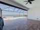 Screened-in pool and spa with a view of the lake and brick paver flooring create an inviting outdoor living space at 23823 Waverly Cir, Venice, FL 34293