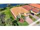 This home boasts lush landscaping, a paver driveway, and a pristine lawn at 23901 Waverly Cir, Venice, FL 34293
