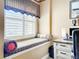 Bright home office area with window seating and custom window treatments at 23901 Waverly Cir, Venice, FL 34293