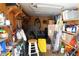 Organized storage area with shelves, various tools, and storage containers, providing ample space at 332 E Langsner St, Englewood, FL 34223