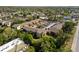 This aerial view highlights the beautiful condo community surrounded by lush greenery and convenient parking at 3417 Clark Rd # 217, Sarasota, FL 34231