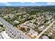 Birds-eye view of condo complex with mature landscaping and nearby shopping at 3417 Clark Rd # 217, Sarasota, FL 34231