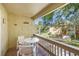 Balcony with seating area, and views of the community's natural landscaping and waterways at 3417 Clark Rd # 217, Sarasota, FL 34231