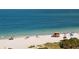 A picturesque beach scene with clear blue water and a lifeguard stand at 3417 Clark Rd # 217, Sarasota, FL 34231