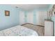 Cozy bedroom featuring an area rug, lots of closet space, and nice wall decor at 3417 Clark Rd # 217, Sarasota, FL 34231