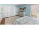 Bright bedroom featuring an area rug, window, and double-door closets at 3417 Clark Rd # 217, Sarasota, FL 34231