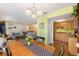 Open-concept living area with a dining table and access to a well-appointed kitchen at 3417 Clark Rd # 217, Sarasota, FL 34231