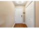 Cozy entryway featuring wood floors, a coat closet, and a white front door at 3417 Clark Rd # 217, Sarasota, FL 34231