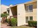 Condo exterior highlighting the covered entryway and well-maintained landscaping at 3417 Clark Rd # 217, Sarasota, FL 34231