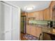 Well-lit kitchen features granite countertops, stainless appliances and ample cabinet storage at 3417 Clark Rd # 217, Sarasota, FL 34231