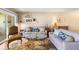 Cozy living room with decorative accents, comfortable sofas, and a glass coffee table at 3417 Clark Rd # 217, Sarasota, FL 34231