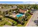 Enjoy a relaxing community pool with a spacious sundeck and beautiful landscaping, perfect for leisure and socializing at 3417 Clark Rd # 217, Sarasota, FL 34231