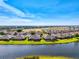 Panoramic aerial view of the neighborhood showcasing lakefront properties and well-manicured lawns at 3459 Lakewood Blvd, North Port, FL 34287