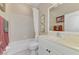 Bright bathroom with a shower and bathtub combination, and a white vanity at 3459 Lakewood Blvd, North Port, FL 34287