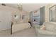 Cozy bedroom features a comfortable daybed, ample natural light, and a calming color scheme at 3459 Lakewood Blvd, North Port, FL 34287