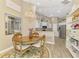 Charming dining area featuring an elegant chandelier and a cozy table, perfect for Gathering meals at 3459 Lakewood Blvd, North Port, FL 34287