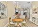 Elegant dining area featuring a chandelier and a table, complementing the modern kitchen design at 3459 Lakewood Blvd, North Port, FL 34287