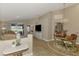Open-concept living space with a dining area featuring a chandelier, seamlessly connected to the living room at 3459 Lakewood Blvd, North Port, FL 34287
