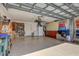 Spacious garage featuring ample storage and a refrigerator and sink at 3459 Lakewood Blvd, North Port, FL 34287
