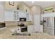 Well-equipped kitchen with modern appliances, granite countertops, and functional layout at 3459 Lakewood Blvd, North Port, FL 34287