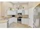 Bright kitchen featuring white cabinetry, stainless steel appliances, and plenty of counter space at 3459 Lakewood Blvd, North Port, FL 34287
