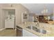 Modern kitchen featuring stainless steel appliances, granite countertops, and seamless design at 3459 Lakewood Blvd, North Port, FL 34287