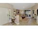 Welcoming living room with sliding glass doors and stylish decor, offering a comfortable and inviting space at 3459 Lakewood Blvd, North Port, FL 34287