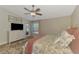 The main bedroom boasts a ceiling fan, large window and sliding glass door access to the outdoor space at 3459 Lakewood Blvd, North Port, FL 34287