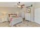 The main bedroom offers a serene retreat with a ceiling fan, stylish furnishings, and closet at 3459 Lakewood Blvd, North Port, FL 34287