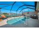 Relaxing screened-in pool area with a tranquil lake view, perfect for enjoying the outdoors in comfort at 3459 Lakewood Blvd, North Port, FL 34287