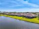 Aerial shot showcasing waterfront homes with lush lawns and scenic lake views at 3459 Lakewood Blvd, North Port, FL 34287