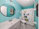 Charming bathroom with blue walls and fun decor at 4070 Kincord Ln, North Port, FL 34287
