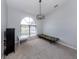 Bright bedroom with large arched window and carpeted flooring at 4070 Kincord Ln, North Port, FL 34287